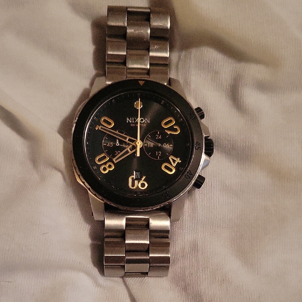 Nixon Black and Gold Watch